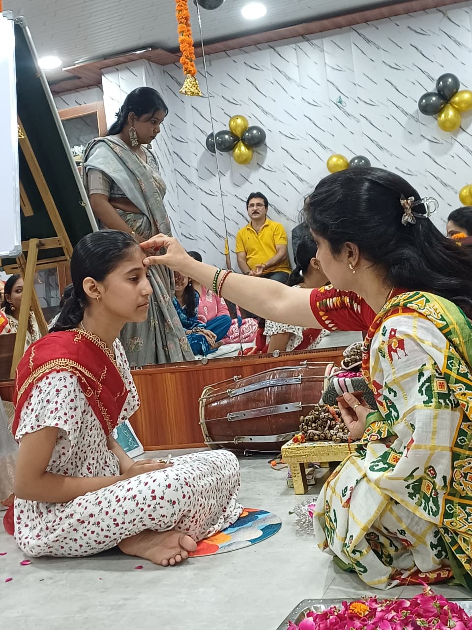 Guru Shivani Patel applying tilak during Ghungroo Puja blessing ceremony