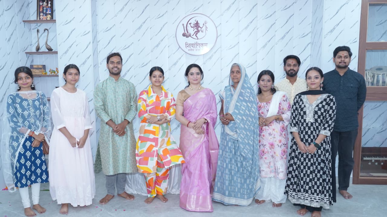 Tabla and vocal students on stage with guru